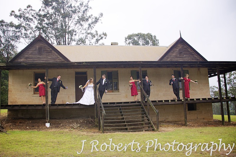 Bridal party on the verandah of historic house - wedding photography sydney